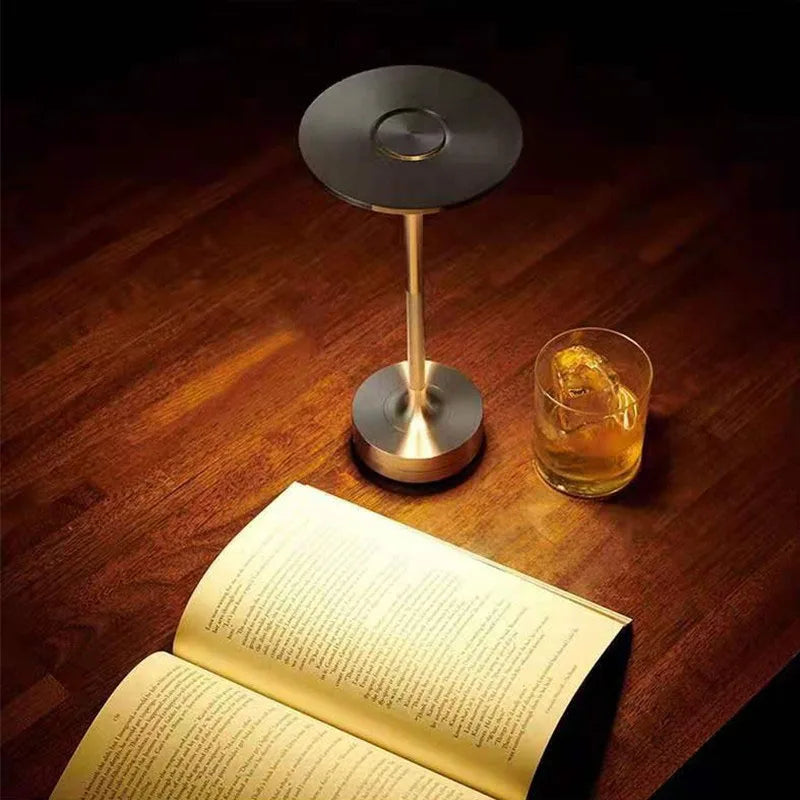 Steampunk Desk Lamp with an adjustable touch dimmer switch, illuminating a workspace with a warm glow.