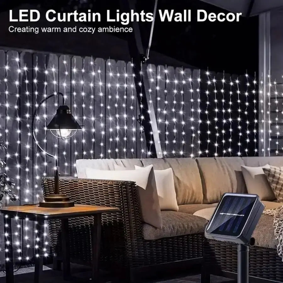 SolarCurtain™ Waterproof LED Fairy Lights illuminating a beautiful outdoor garden space with a warm, enchanting glow, showcasing their durable and versatile design perfect for both indoor and outdoor festive decorations.