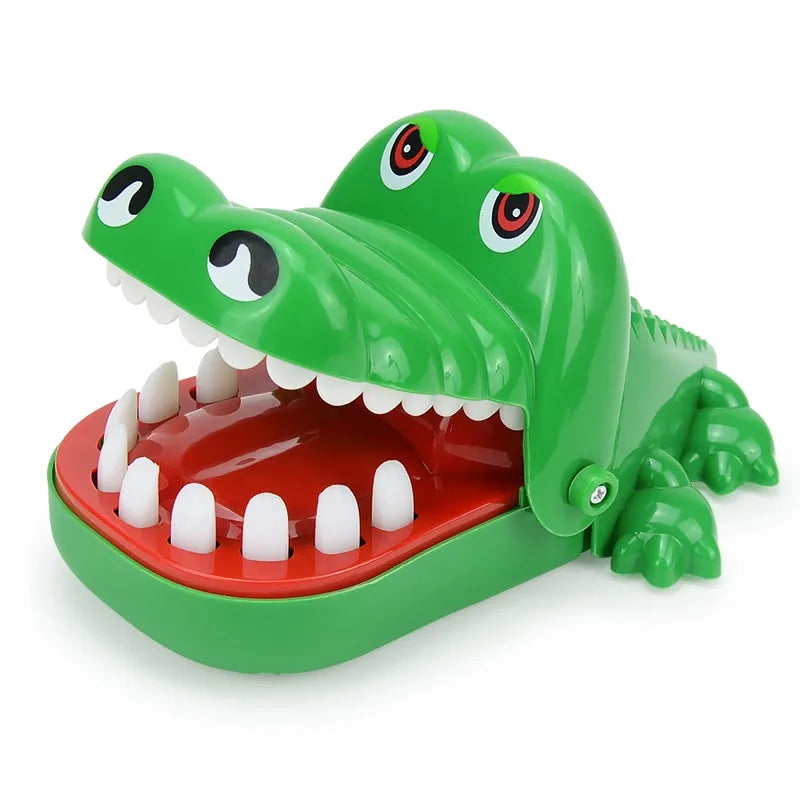 A green toy alligator with large teeth, open wide as if ready to snap.