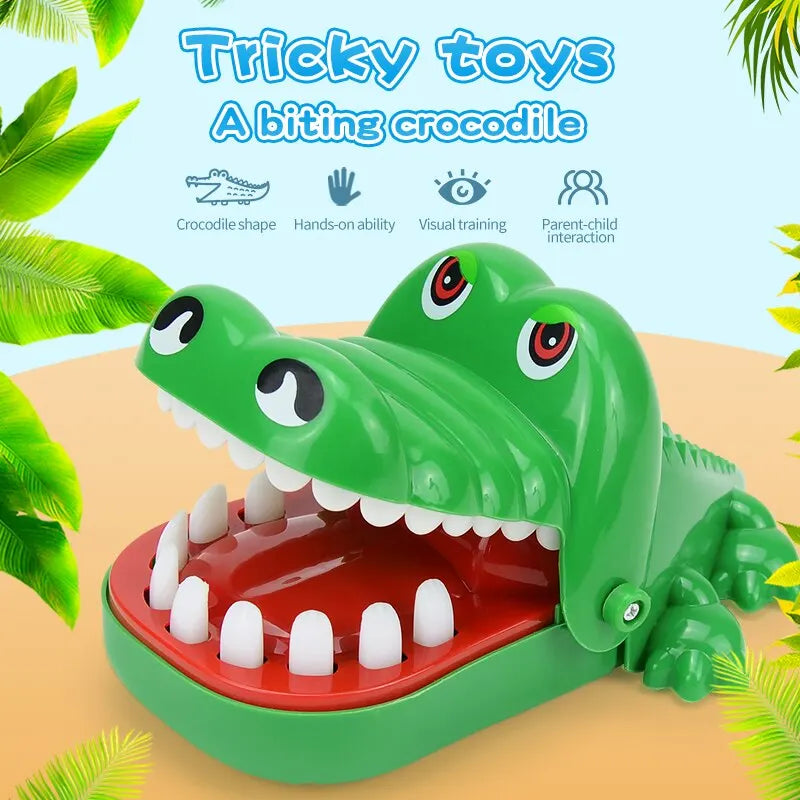 A green toy alligator with large teeth, open wide as if ready to snap.