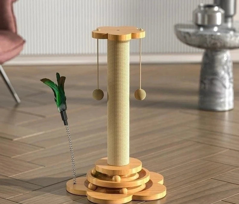 A beige Ndotohuis Kitty Clubhouse with a sisal scratching post in the center, a spinning turntable with colorful balls on top, and a sleek wooden base.