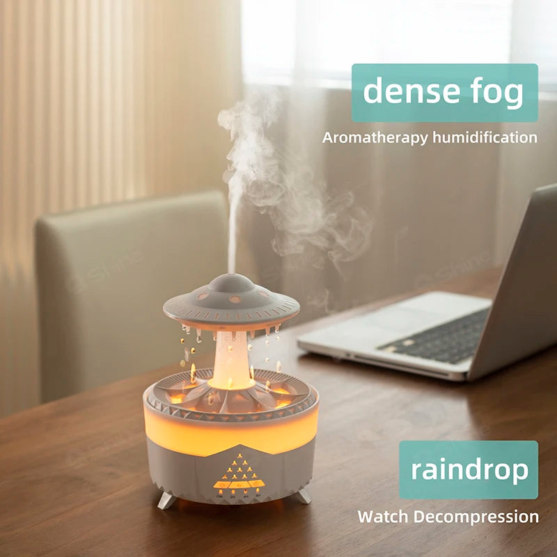 A white Ndotohuis 3-in-1 Rain Cloud Diffuser in the shape of a cloud, emitting cool mist and featuring a glowing rain cloud design.