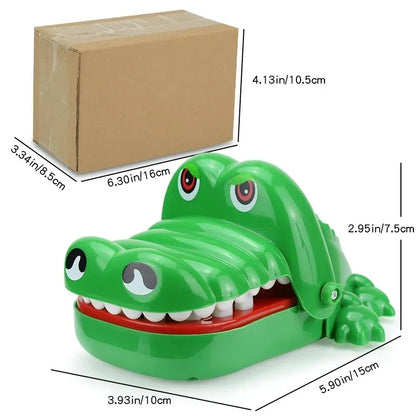 A green toy alligator with large teeth, open wide as if ready to snap.