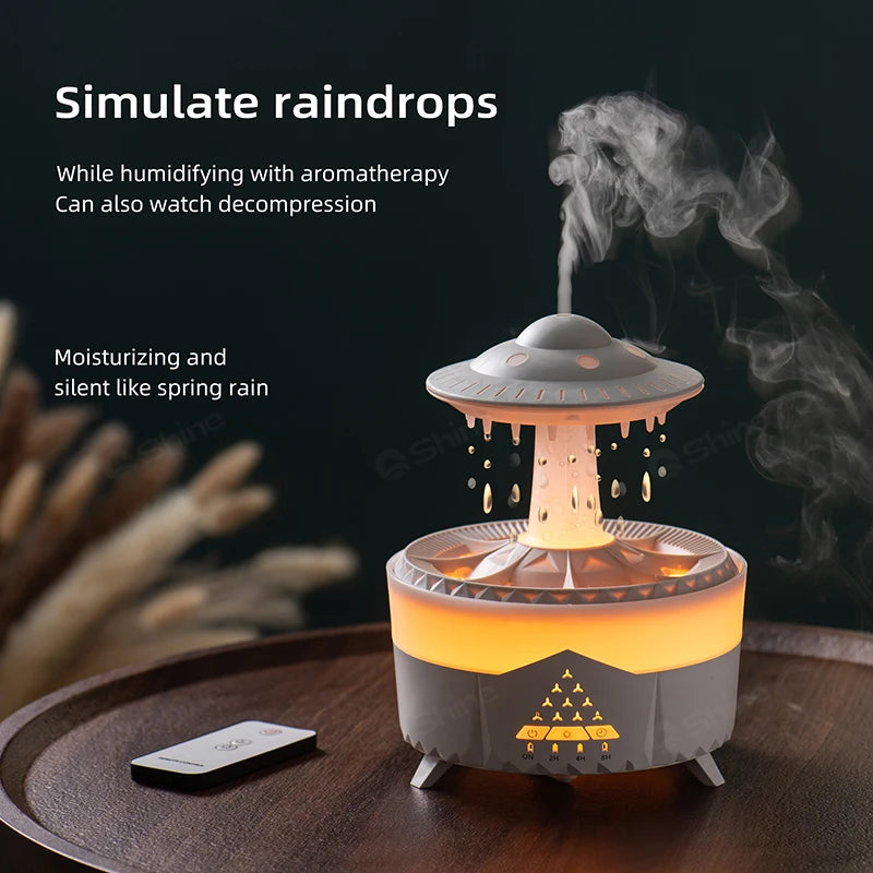 A white Ndotohuis 3-in-1 Rain Cloud Diffuser in the shape of a cloud, emitting cool mist and featuring a glowing rain cloud design.