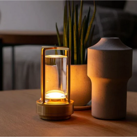 LuxeGlow™ cordless LED table lamp with a warm glow, illuminating a cozy reading nook.