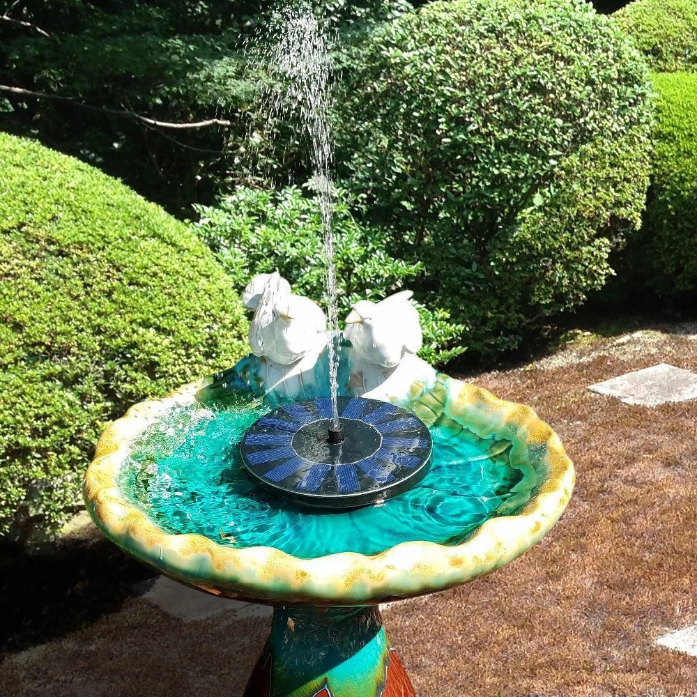 SolarFountain™ | Floating Garden Waterfall Pump in a bird bath, creating a serene and eco-friendly water feature in a garden setting.